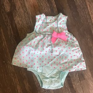 Light blue onesie with pink ladybugs